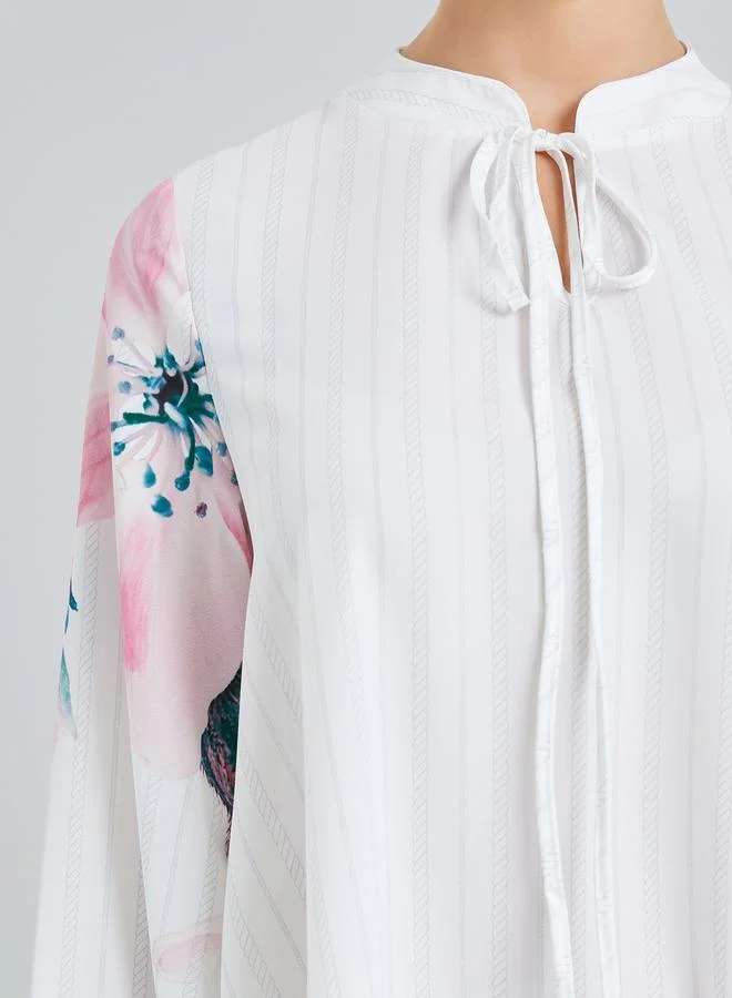 ستايلي جلابية بطبعة زهور برباط عنق بقصة واسعة